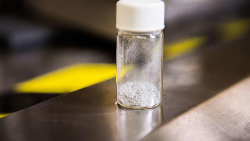 a small vial of white powder