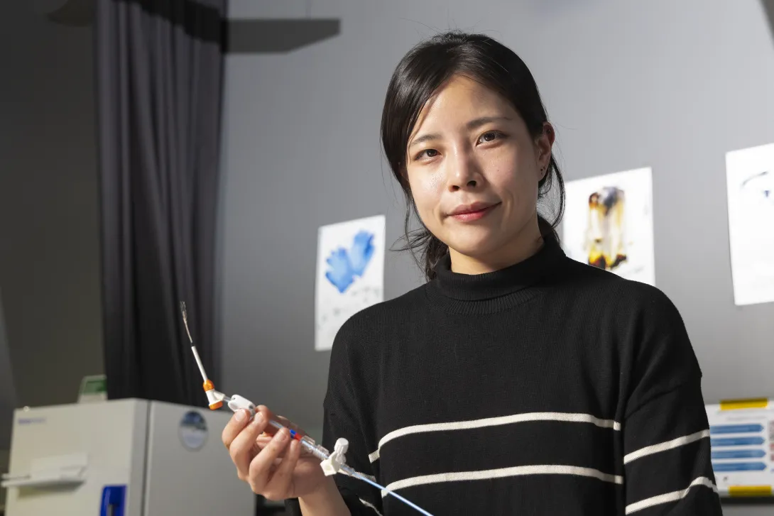 Female researcher in Hong Yeo&#039;s lab holding a nanosensor